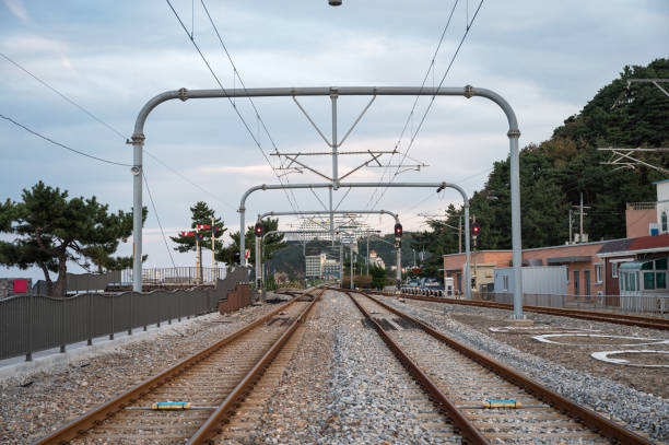 istock Railway track and commuter electric pole 1297641565