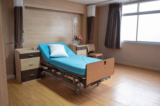 istock Empty adjustable patient bed with saline solution in private room at hospital 1297641577