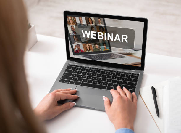 istock Cropped of woman using laptop, having webinar 1297642715