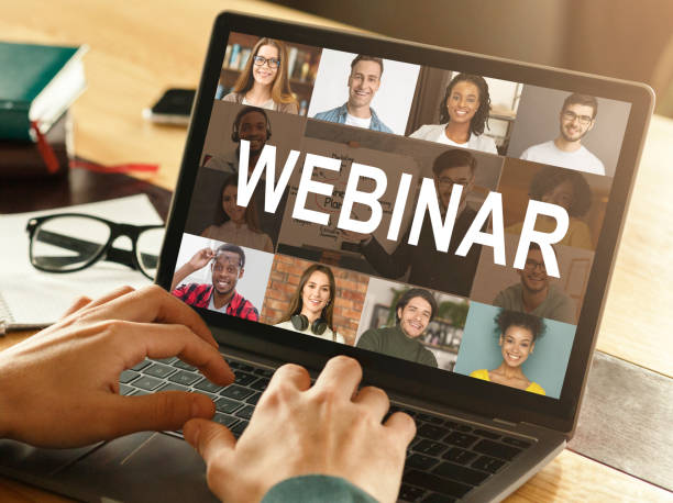 istock Male hands typing on laptop with webinar lettering 1297642774