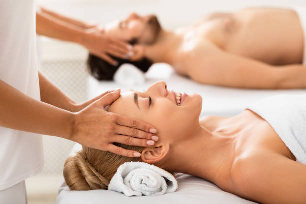 istock Spouses Receiving Head Massage Enjoying Therapy Together Indoor 1297643229
