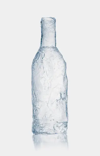 Bottle form, made from clean, transparent ice. Purity and freshness concept.