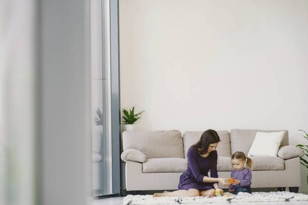 istock Cheerful mom playing laughing with little kid daughter 1297644103