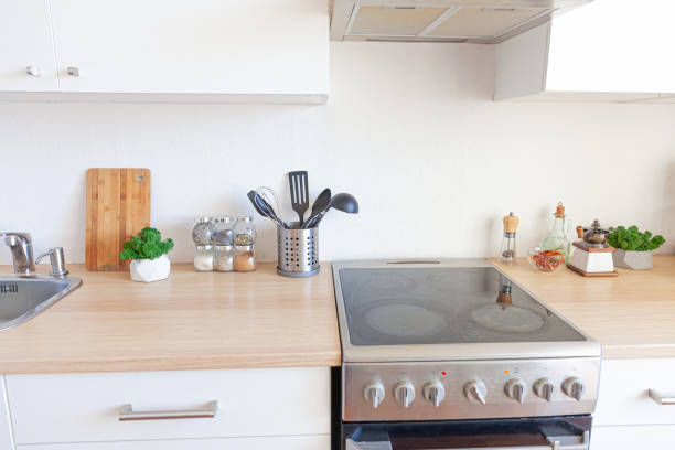 istock Scandinavian classic minimalistic kitchen with white and wooden details. Modern white kitchen clean contemporary style interior design 1297644948