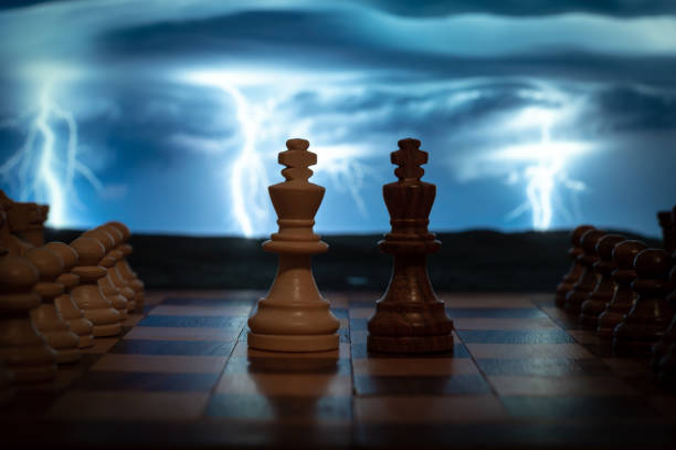 istock Game-in-play chess board with a thunderstorm background with lightning and lightning on a cloudy day that adds intensity and tension. 1297646996