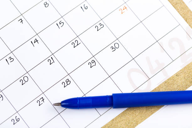 istock white calendar page for 2021 month schedule to make an appointment or manage the schedule every day with ballpoint pen for marks, for work planning and life concept 1297649443
