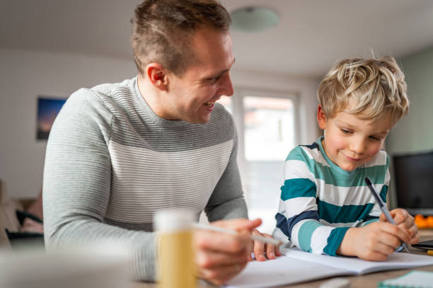 istock Father and son during homeschooling 1297650019