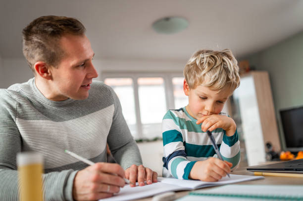 istock Father and son during homeschooling 1297650158