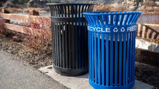 istock Blue metal recycle bin the park 1297650223