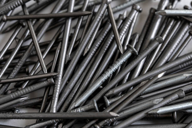 Extreme close up of a pile of metal nails stock photo