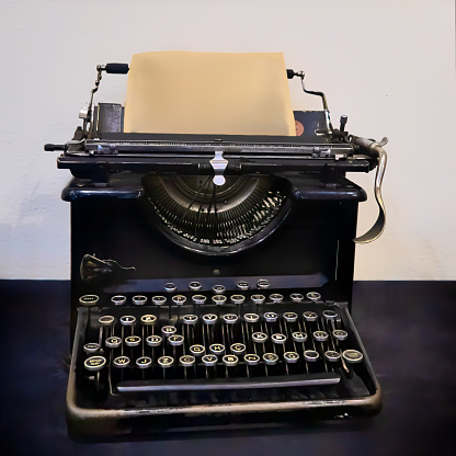 An antique black manual typewriter keyboard with its round keys was common in offices before the invention of the electric typewriter.