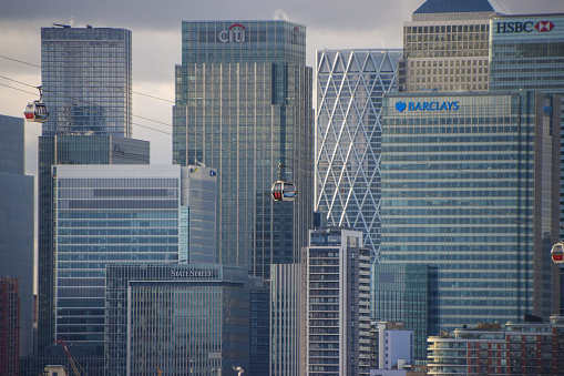 London, United Kingdom - January 2 2021: daytime view of Canary Wharf  corporate buildings and skyscrapers,