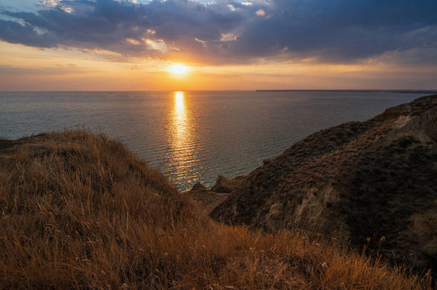 istock Sunset Stanislav clay mountains and canyons above Dnipro river bay, Ukraine 1297651283
