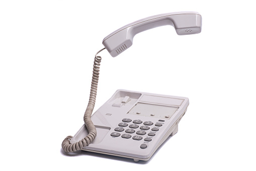 Vintage telephone with levitating phone handset isolated on white background
