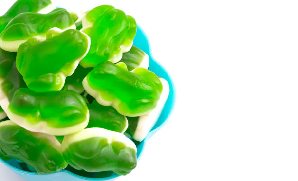 Gummy Green Frogs with a Mashmallow Candy Bottom Layer Isolated on a White Background