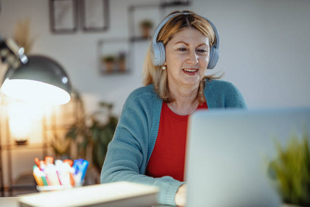 istock Overworked woman working at home on laptop, learning new skills over internet 1297655005