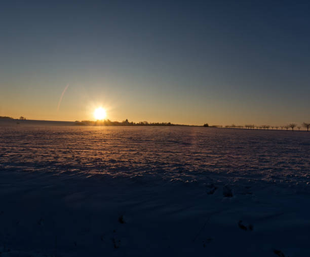 istock Sunset in thuringia with snow at krippendorf in winter 1297656273