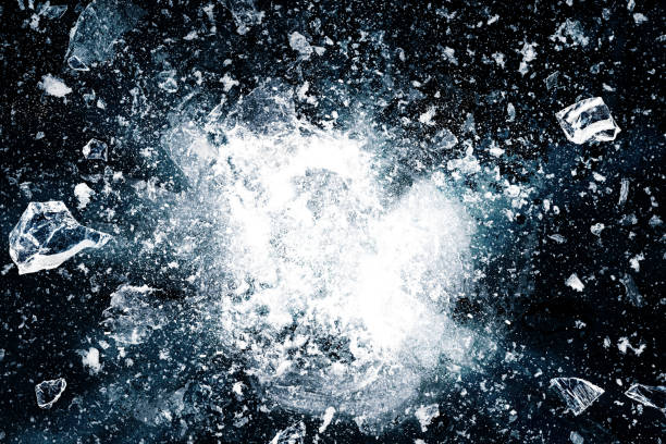 Ice, crushed on black background. Pieces of crushed ice spreading away. The explosion of ice. Ice, crushed on black background. Pieces of crushed ice spreading away. The explosion of ice. ice stock pictures, royalty-free photos & images