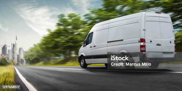 Delivery Van Delivers In A City Stock Photo - Download Image Now - Van - Vehicle, Delivery Van, Delivering