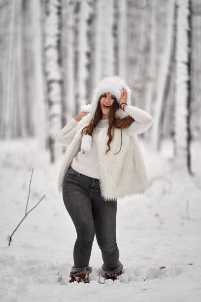 istock Woman in the snowy forest 1297660084