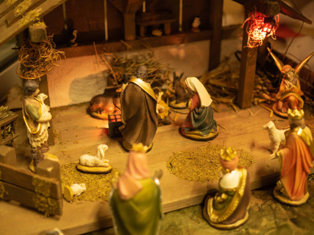 istock Christmas composition. Creche in front of christmas tree. Perspective view. 1297662231