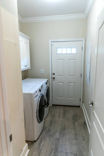 istock small narrow laundry room with washer and dryer 1297662249