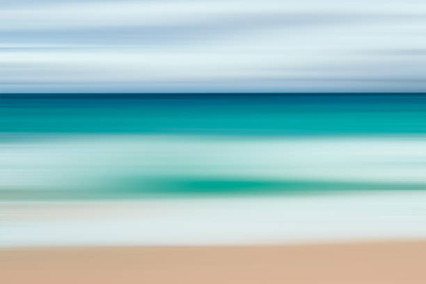 istock A seascape abstract with panning motion combined with a long exposure.  Image displays soft, pastel colors in a retro style. 1297662626