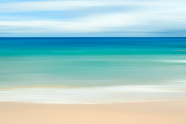 istock A seascape abstract with panning motion combined with a long exposure.  Image displays soft, pastel colors in a retro style. 1297662802