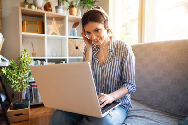 istock Smiling beautiful woman having video call 1297669263