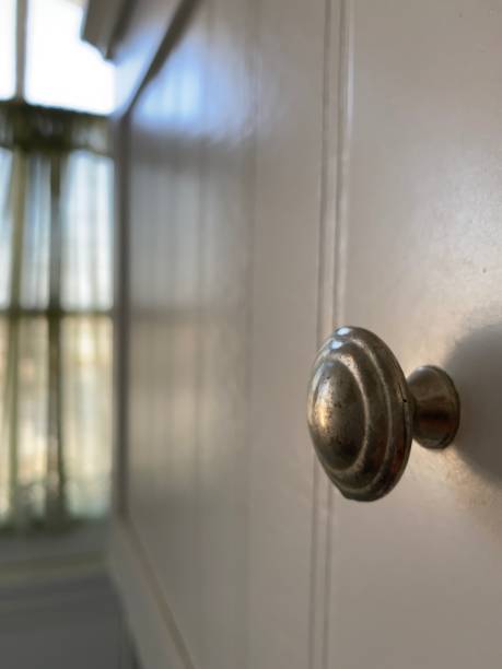 istock Doorknob with an out of focus window 1297670198