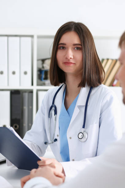 istock Beautiful smiling female doctor hold 1297670450