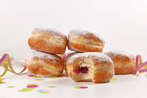 istock Traditional German donut like dessert called 'Berliner Pfannkuchen' filled with jam made from sweet yeast dough fried in fat 1297672430