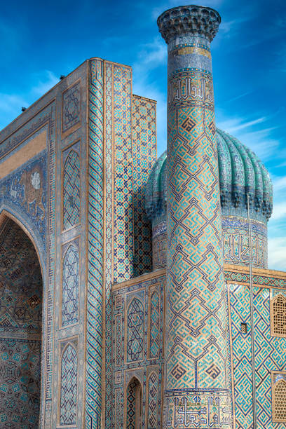 Sher-Dor Madressa, Registan Square, Samarkand, historic silk road, Uzbekistan Detail of the of Sher-Dor Madrasah (Madressa) at Registan Square in the city of Samarkand. The Madressa was built in the early 17th century. The full ensemble of the Registan Square is listed as UNESCO World Heritage Site. Samarkand was one of the most important oasis and place of caravanserais at the Great Silk Road. samarkand stock pictures, royalty-free photos & images