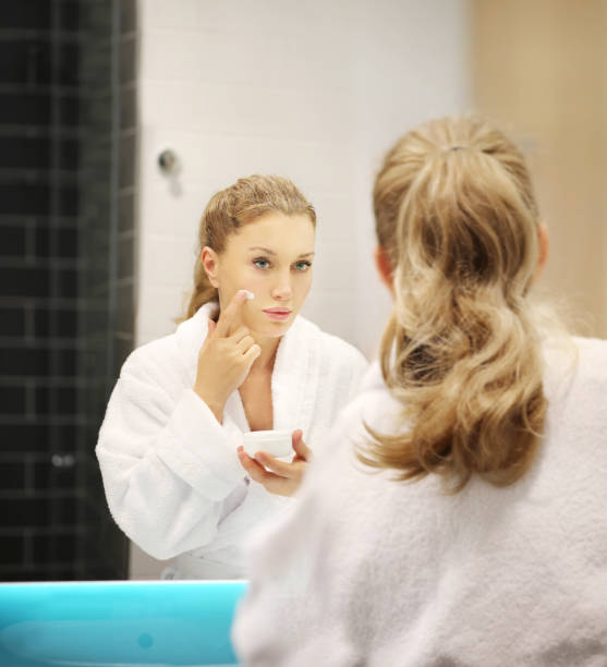 istock Magic anti-aging cream.Applying the cream.. 1297673900
