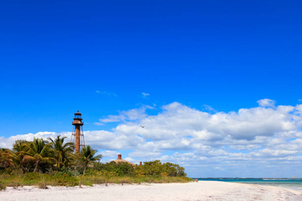 Old lighthouse of Sanibel Island and beach Old lighthouse of Sanibel Island and beach, Florida, USA sanibel island stock pictures, royalty-free photos & images