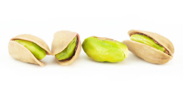 istock Peeled roasted pistachios isolated on white background, healthy nut 1297676103