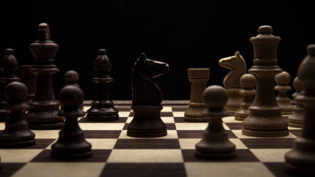istock Knight in a chess duel on the chessboard 1297676778