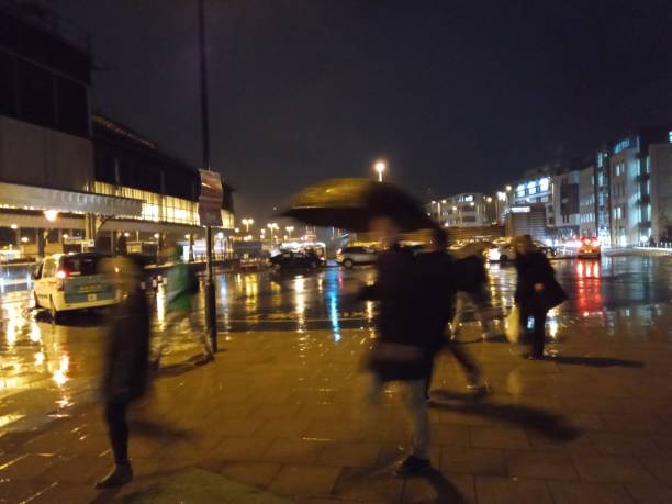 istock Taxi rank at night in rain 1297677052
