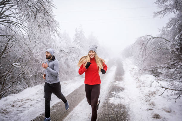 istock Jogging on snowy winter day 1297677770