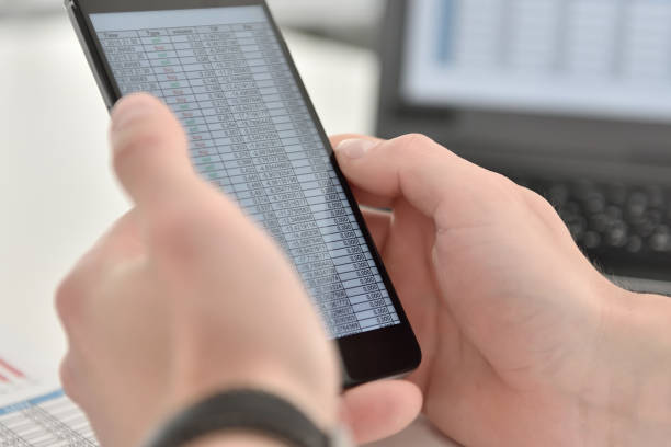 istock Businessman checks business data on cellphone. 1297678637
