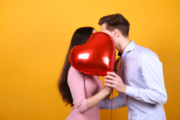 istock Young beautiful couple posing in studio. 1297680881