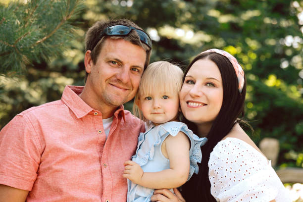 istock Family of Three Outside 1297680907