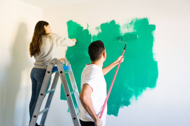 istock Latin couple redecorating and renovating their room 1297682412