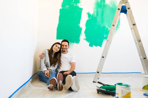 istock Attractive couple doing a renovation in their home 1297682630