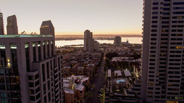 istock Modern Office Buildings in Downtown San Diego with Setting Sun Shining on Bay 1297684367