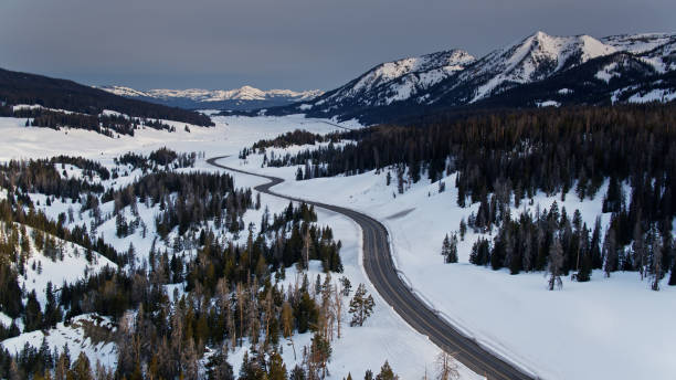 istock Empty Road in Snowy Landscape - Aerial 1297686914
