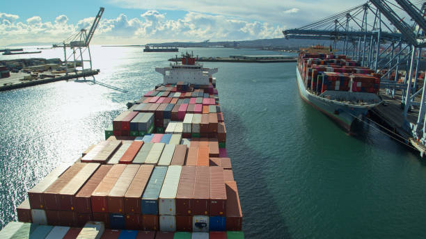 istock Cargo Ship Coming Into Port - Aerial 1297687827