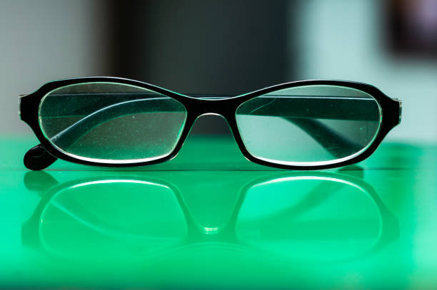istock Eyeglasses placed on the green background 1297687963