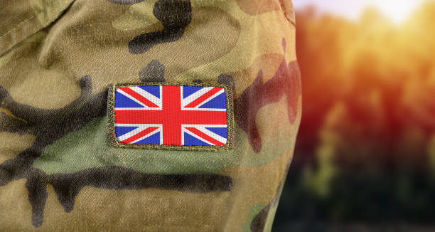 detail of uk soldier UK patch flag on soldiers arm british culture stock pictures, royalty-free photos & images