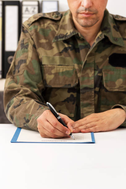 istock soldier filling out questionnaire 1297688687